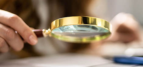 Studying documents with magnifying glass